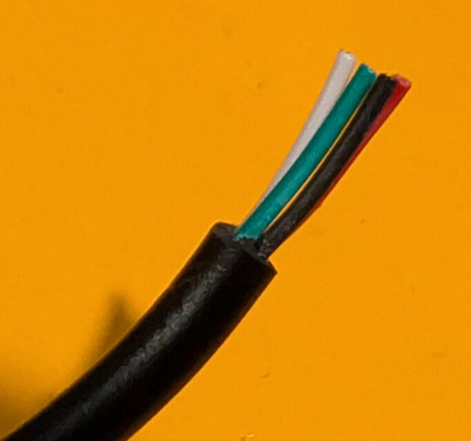 Trimmed cable end with the outer jacket removed to expose the four insulated wires