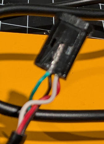 Channel cut into the plastic holder alongside the contact being removed