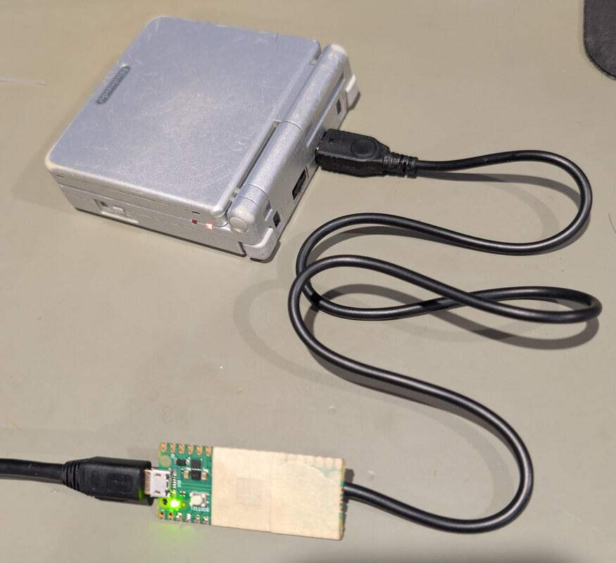 Completed Pico multiboot cable connected by USB and plugged into a Game Boy Advance SP