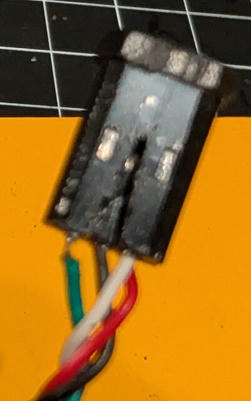 Plastic contact holder after reinserting the repaired pin into position 2