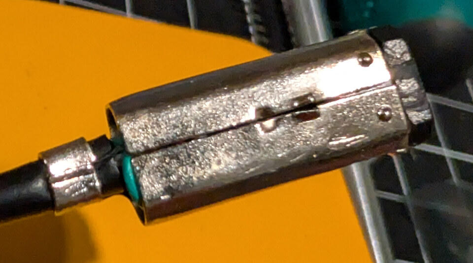 Metal shielding bent closed around the modified GBA link connector