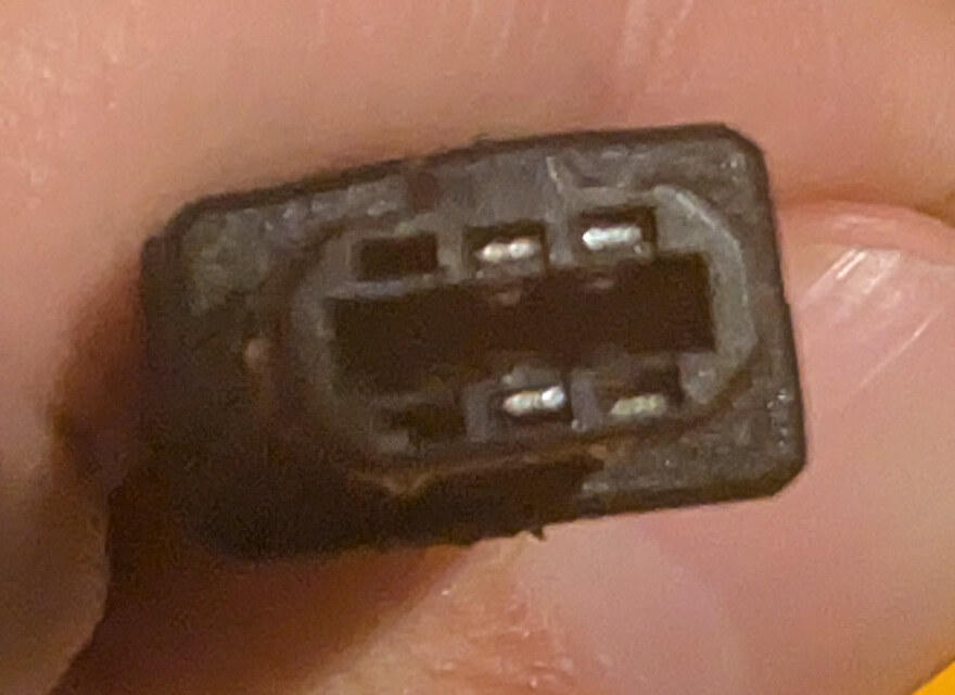 Unmodified GBA link cable plug with contacts in positions 3, 4, 5, and 6